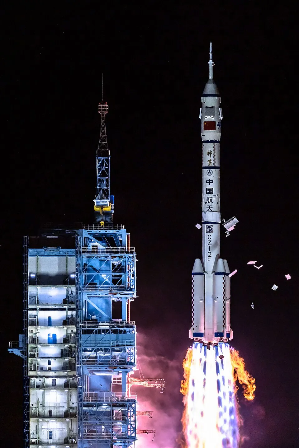 Long March 2F — the human-rated launcher built specifically to carry Shenzhou, with an escape tower and the redundancy required to put people on top. No crew flew until it had proven itself on uncrewed missions.