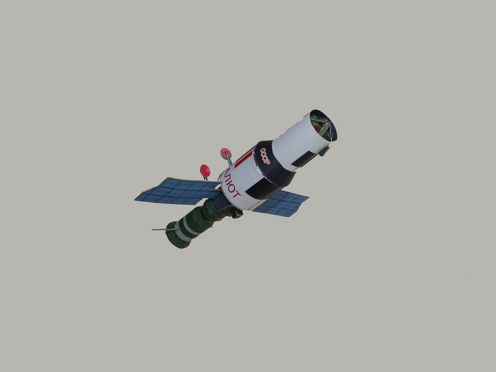 Salyut 3 was, in truth, Almaz — a secret military reconnaissance station flown under the civilian 'Salyut' name to hide its purpose. The Almaz stations carried long-focus cameras to photograph the West, and one test-fired a cannon in orbit.