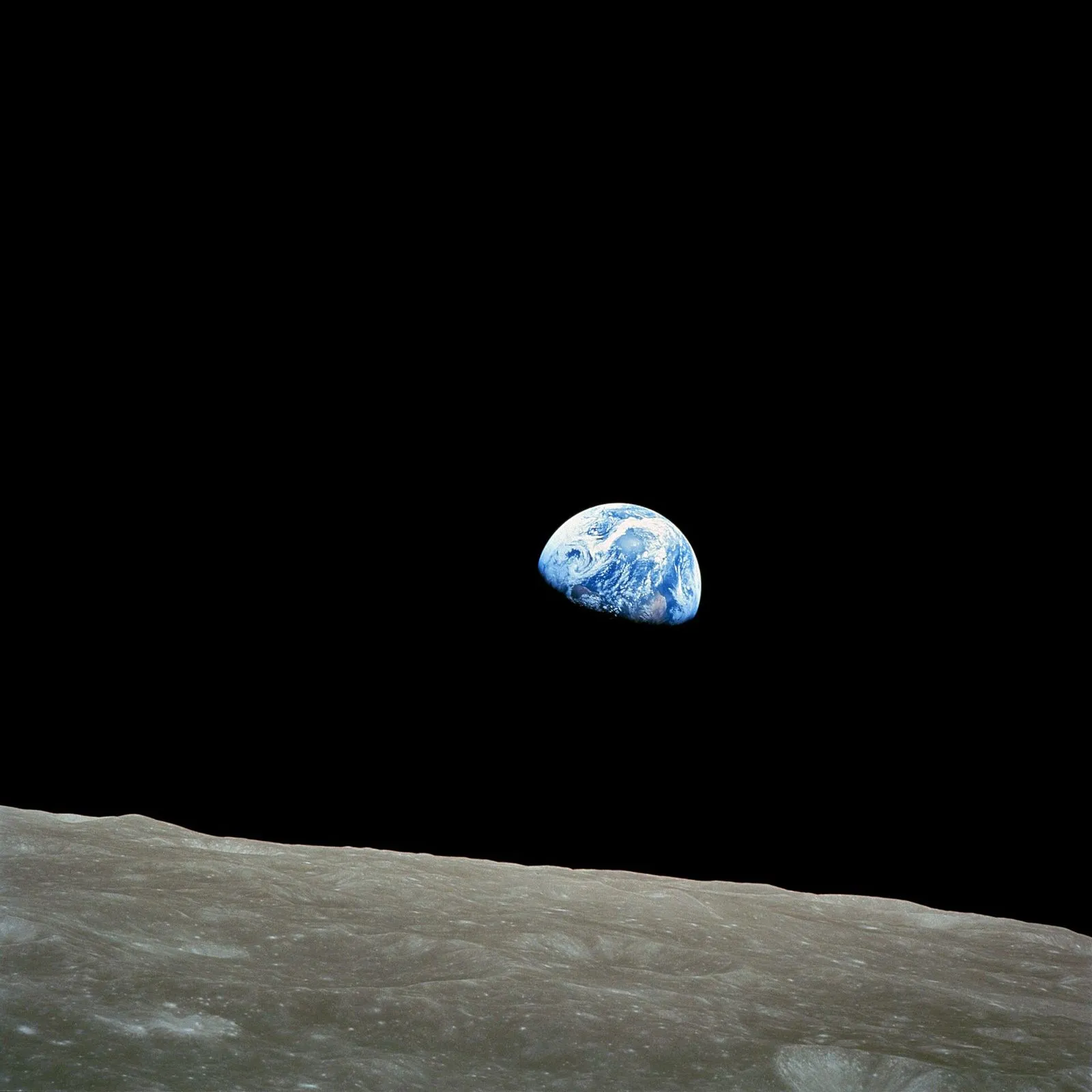 Earthrise — Apollo 8, Christmas Eve 1968. An unplanned photograph that became one of the most reproduced images in history, and a founding picture of the environmental movement.