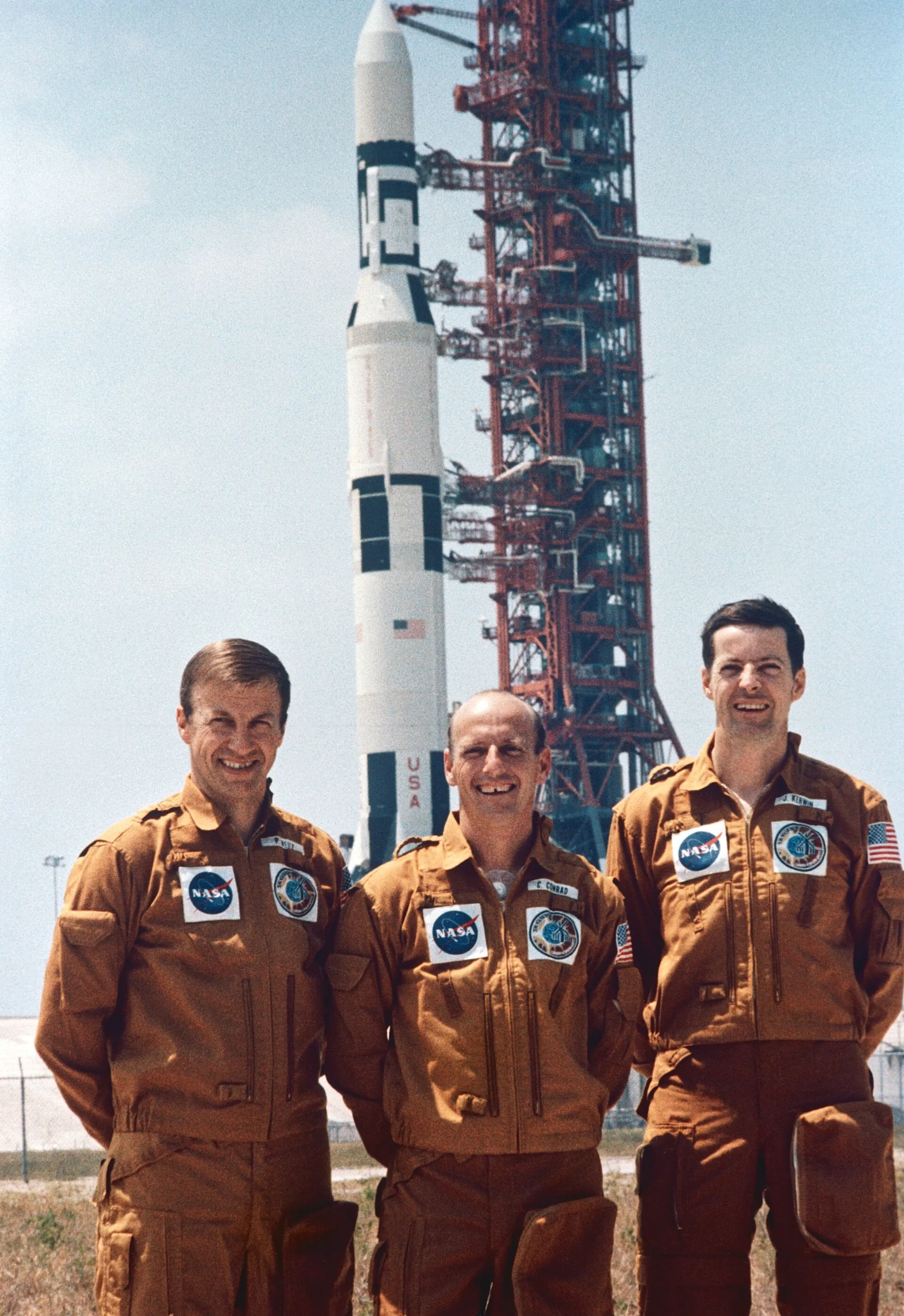 The Skylab 2 crew — Conrad, Kerwin, Weitz — before launch. They flew to a crippled, overheating station and saved it with an improvised sunshade and a hazardous spacewalk, proving crews could repair a spacecraft in orbit.